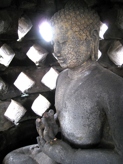 Statue of Buddha at BorobudurTemple at Java